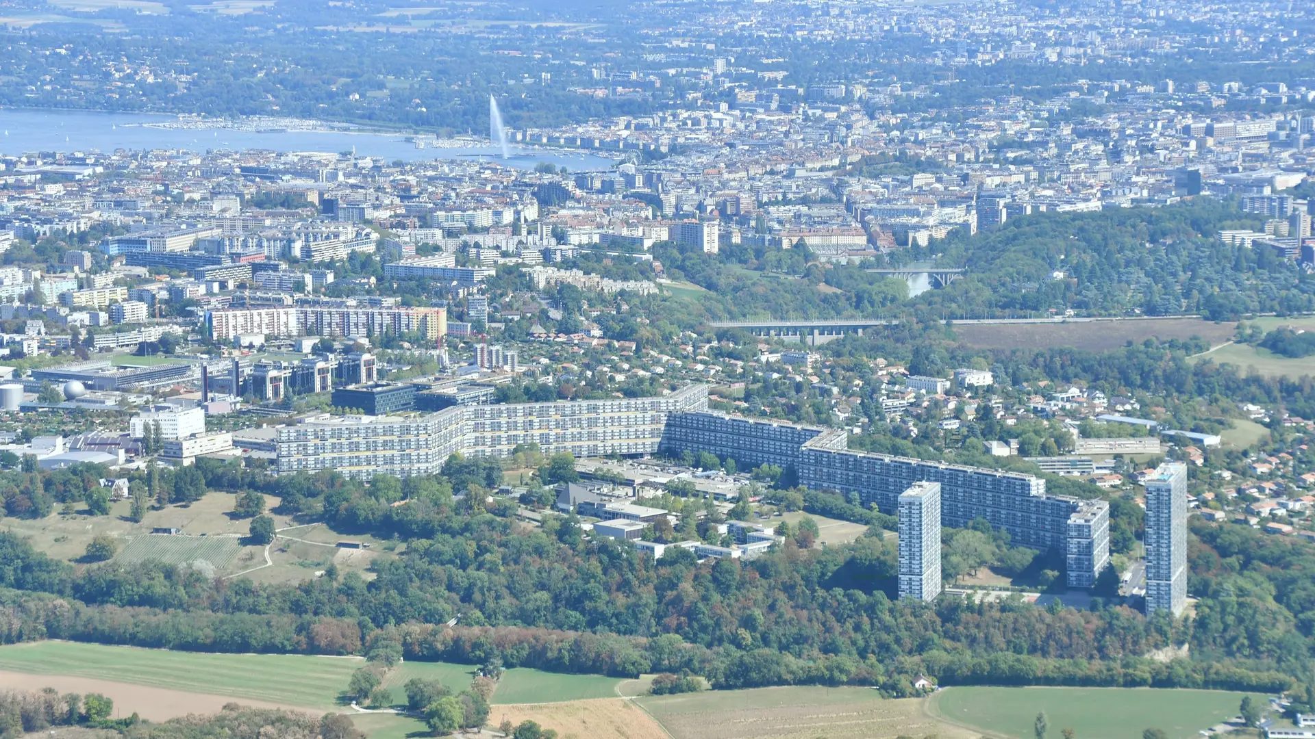 Aerial view of Le Lignon, Geneva — Renovhome SA’s home estate, with the harbour and the Jet d’eau in the background